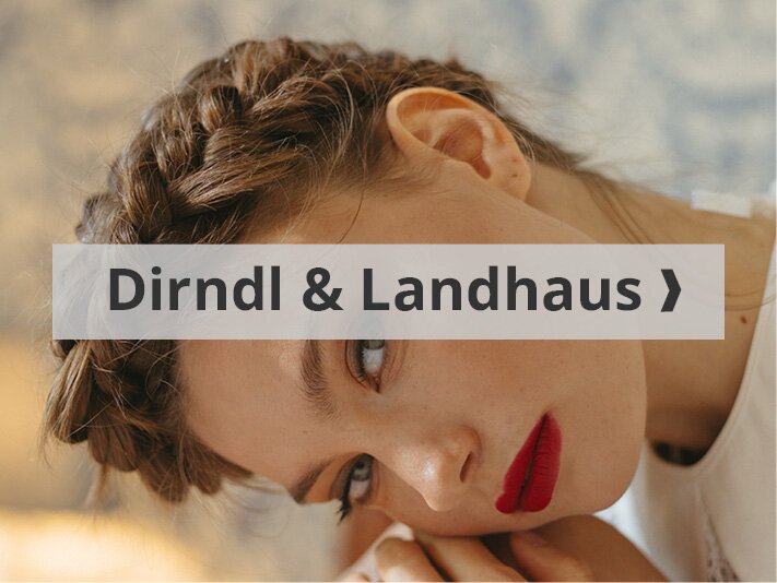 Dirndl und Landhaus Frau mit Flechtzöpfen