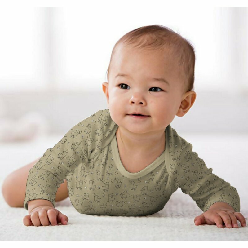 Bild von einem am Bauch liegendem Baby